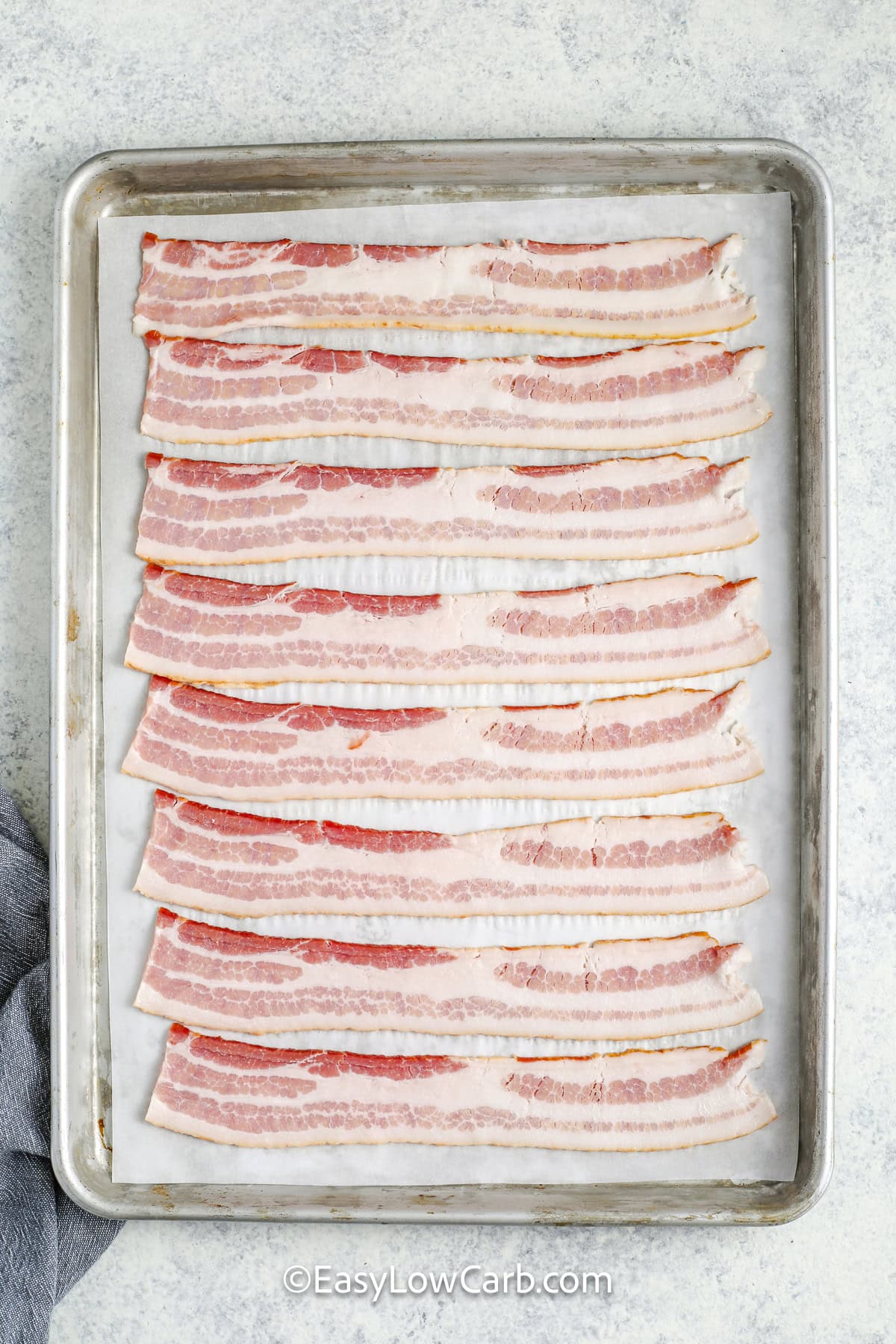 bacon laid out on a baking tray