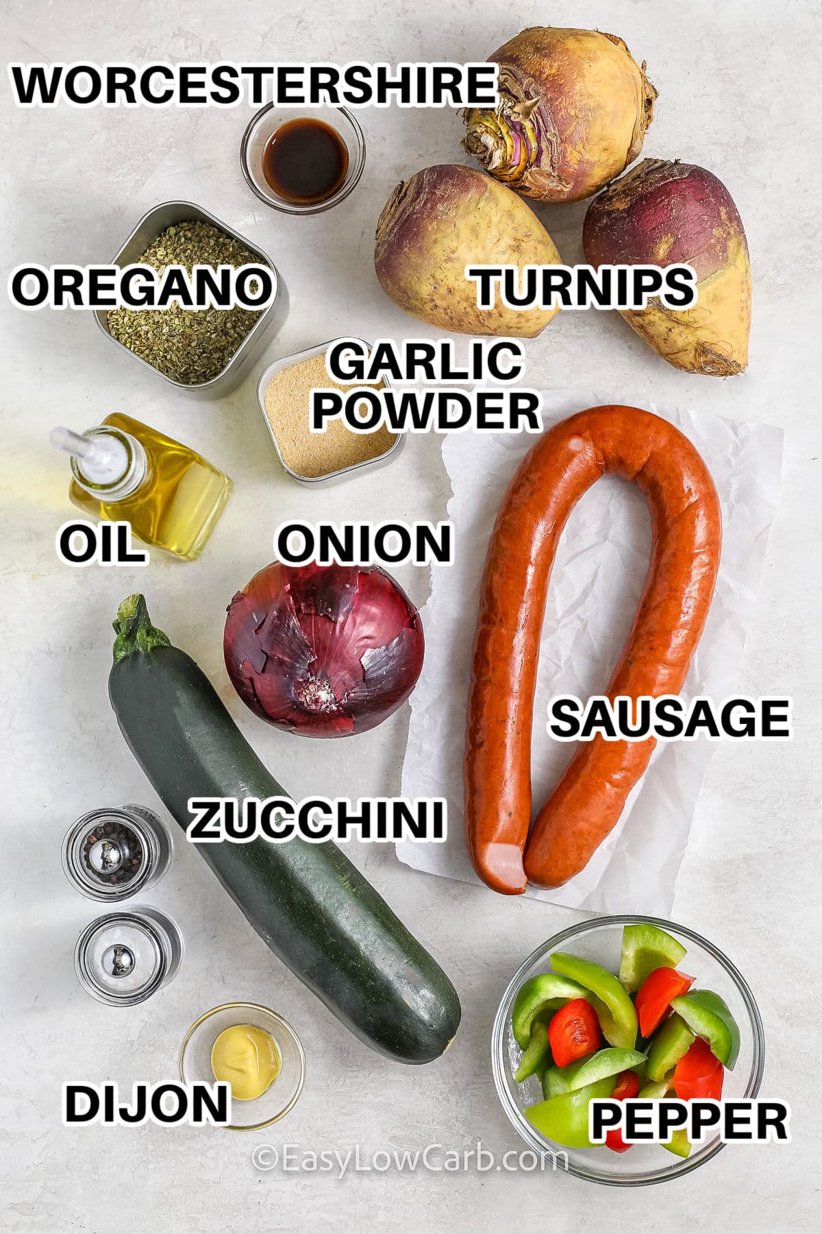 worcestershire sauce, turnips, oregano, garlic powder, onion, oil, sausage, zucchini, dijon and peppers to make Sheet Pan Sausage and Vegetables with labels