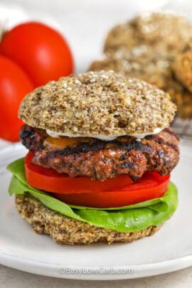 Keto Hamburger Buns with a hamburger , lettuce and tomato