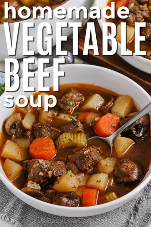 Homemade Vegetable Beef Soup in a bowl with a spoon and title