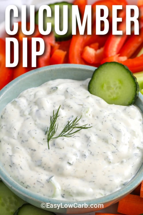 cucumber dip in a bowl with dill and cucumber garnish