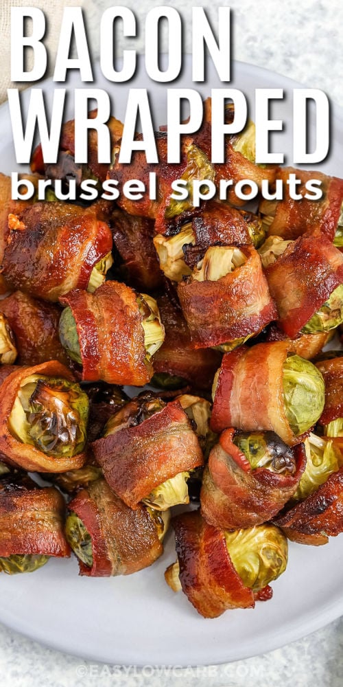 Bacon wrapped brussel sprouts appetizer on a plate with writing