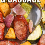 close up of low carb Sheet Pan Sausage and Vegetables with a title