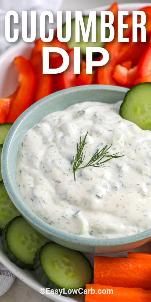 cucumber dip in a bowl surrounded by vegetables