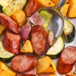 close up of Sheet Pan Sausage and Vegetables on a spoon