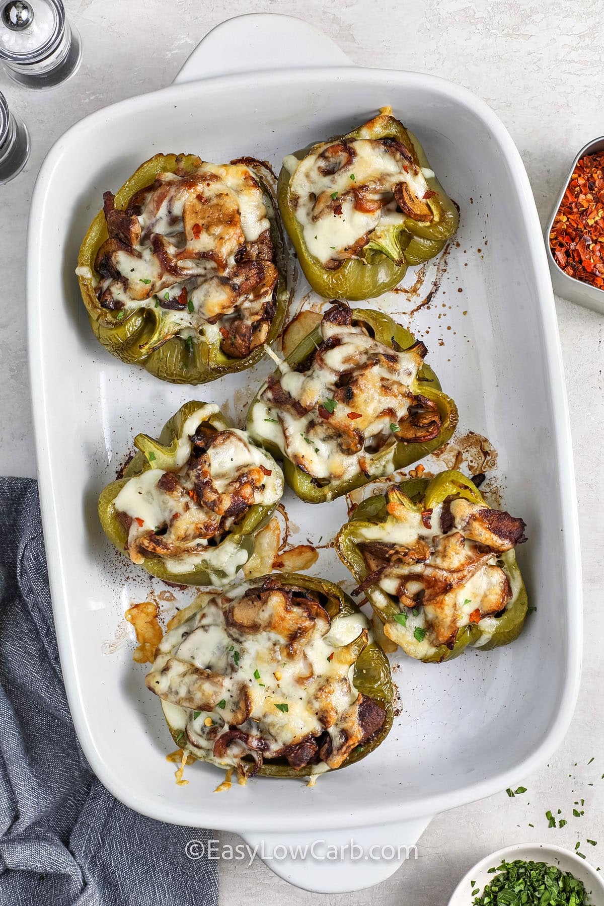 top view from above of a pan of baked cheesesteak stuffed peppers