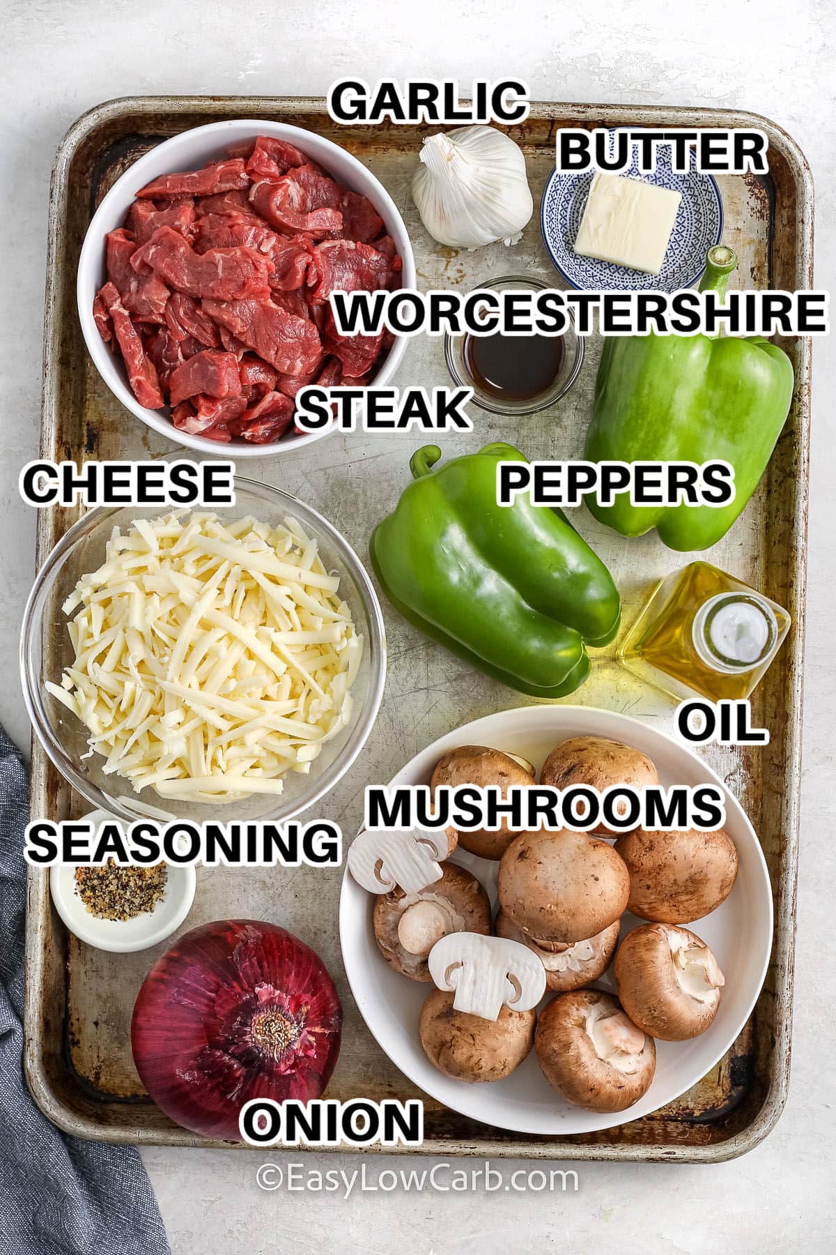 garlic , butter , worcestershire , steak , cheese , peppers , seasonings , mushrooms , oil , and onion with labels to make Cheesesteak Stuffed Peppers