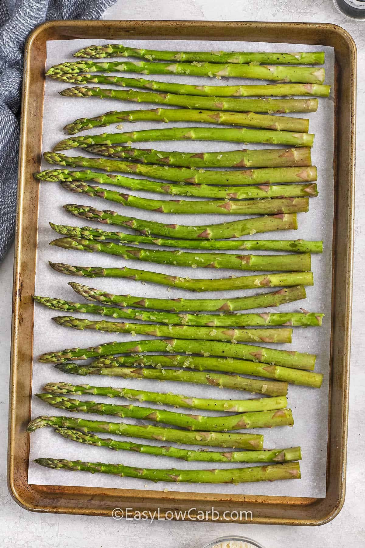 asparagus on a sheet pan to make Parmesan Asparagus