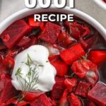 beet soup topped with sour cream in a bowl with a title