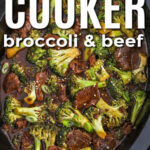Looking down on Slow cooker beef and broccoli cooking in a black crock with writing.