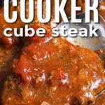 slow cooker cube steak with serving spoon with text