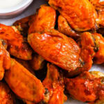 Crockpot Chicken Wings on a plate with dip