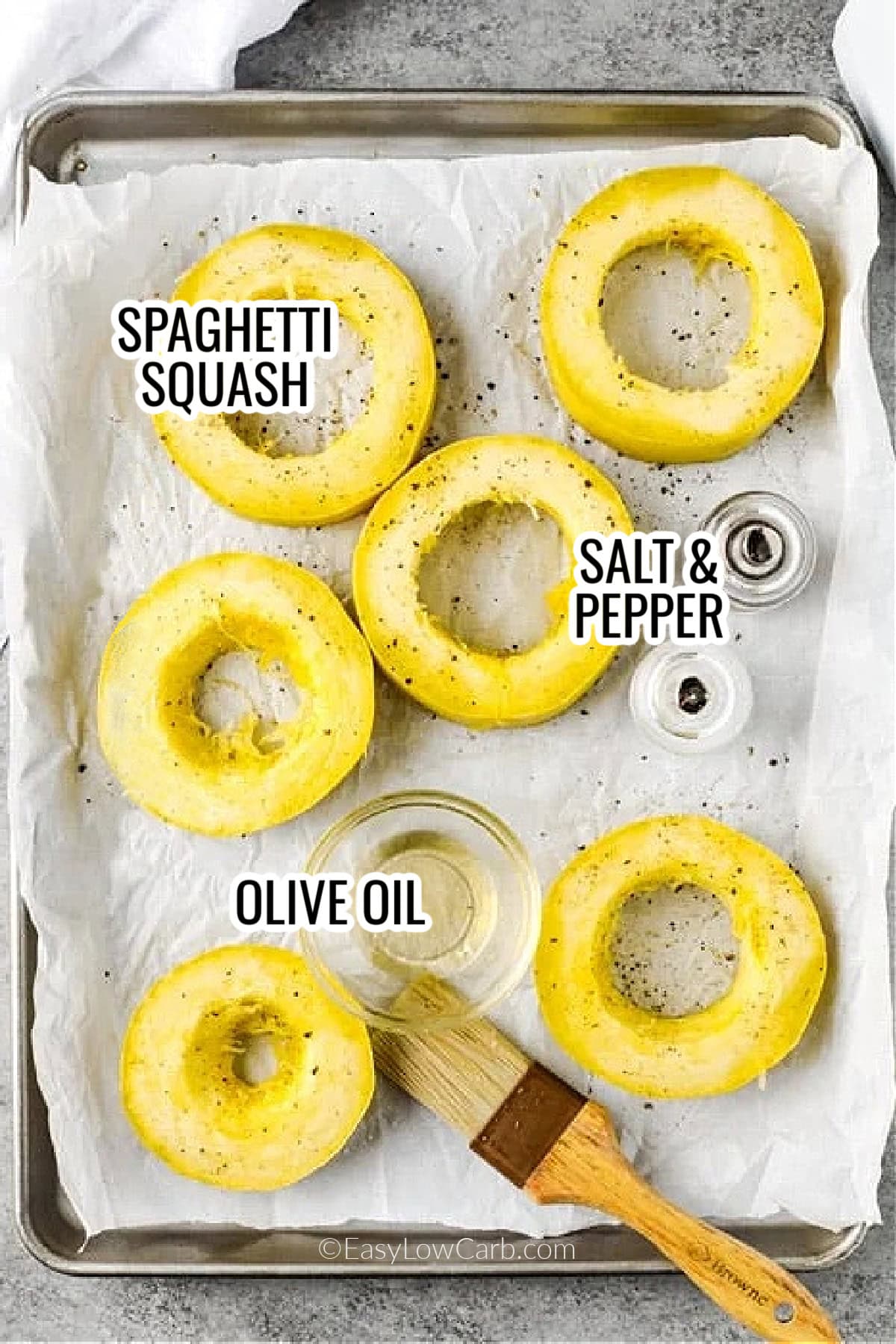 ingredients assembled to make baked spaghetti squash, including spaghetti squash, salt and pepper, and olive oil