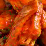 close up of Crockpot Chicken Wings with a title