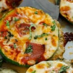 zucchini pizza bites on a pan with text
