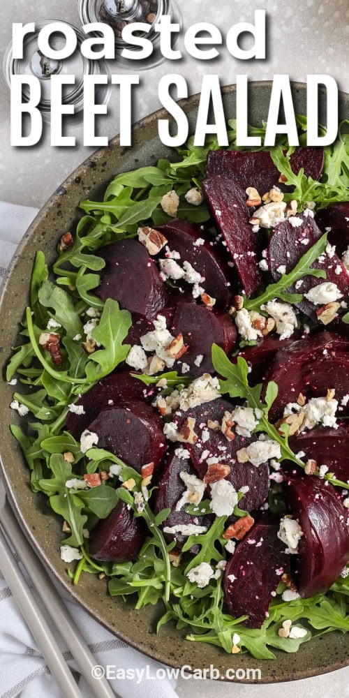 roasted beet salad in a bowl with salt and pepper on the side, with a title