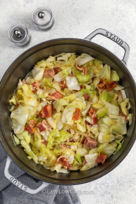 pan full of easy Smothered Cabbage with bacon and ham