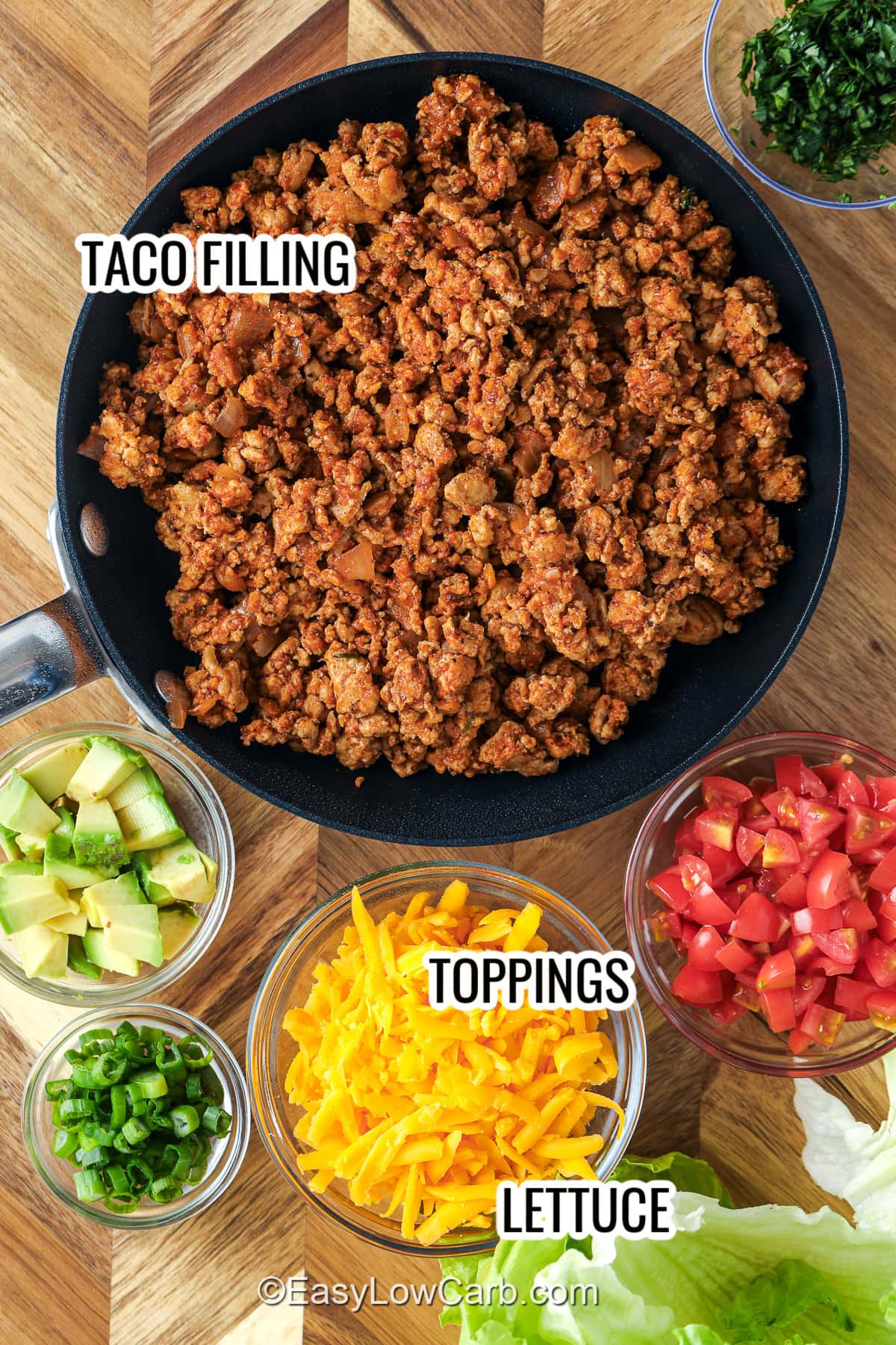 seasoned ground beef taco filling, lettuce, and toppings assembled to make taco lettuce wraps