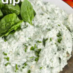 Easy Spinach Dip in a bowl with a spoon and writing