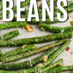 Oven Roasted Green Beans with parmesan on a sheet pan with writing