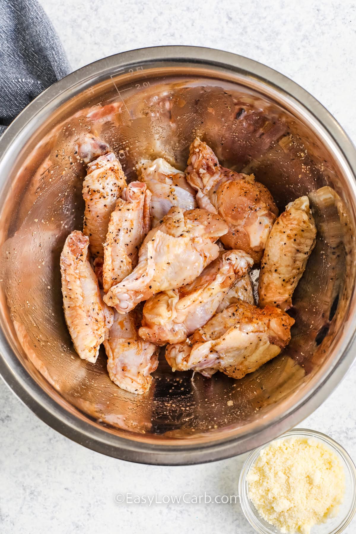 chicken wings and spices in a bowl