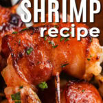 close up of Bacon Wrapped Shrimp Recipe on a skewer with writing