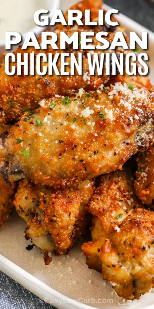 garlic parmesan chicken wings on a plate with text