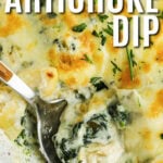 Hot Spinach Artichoke Dip in a bowl with a spoon and writing