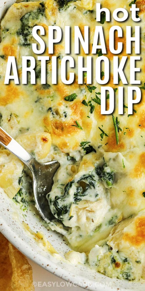 Hot Spinach Artichoke Dip in a bowl with a spoon and writing