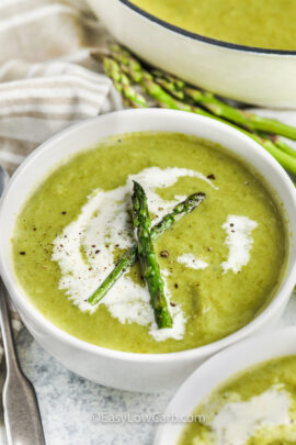 close up of Creamy Asparagus Soup with asparagus pieces on top