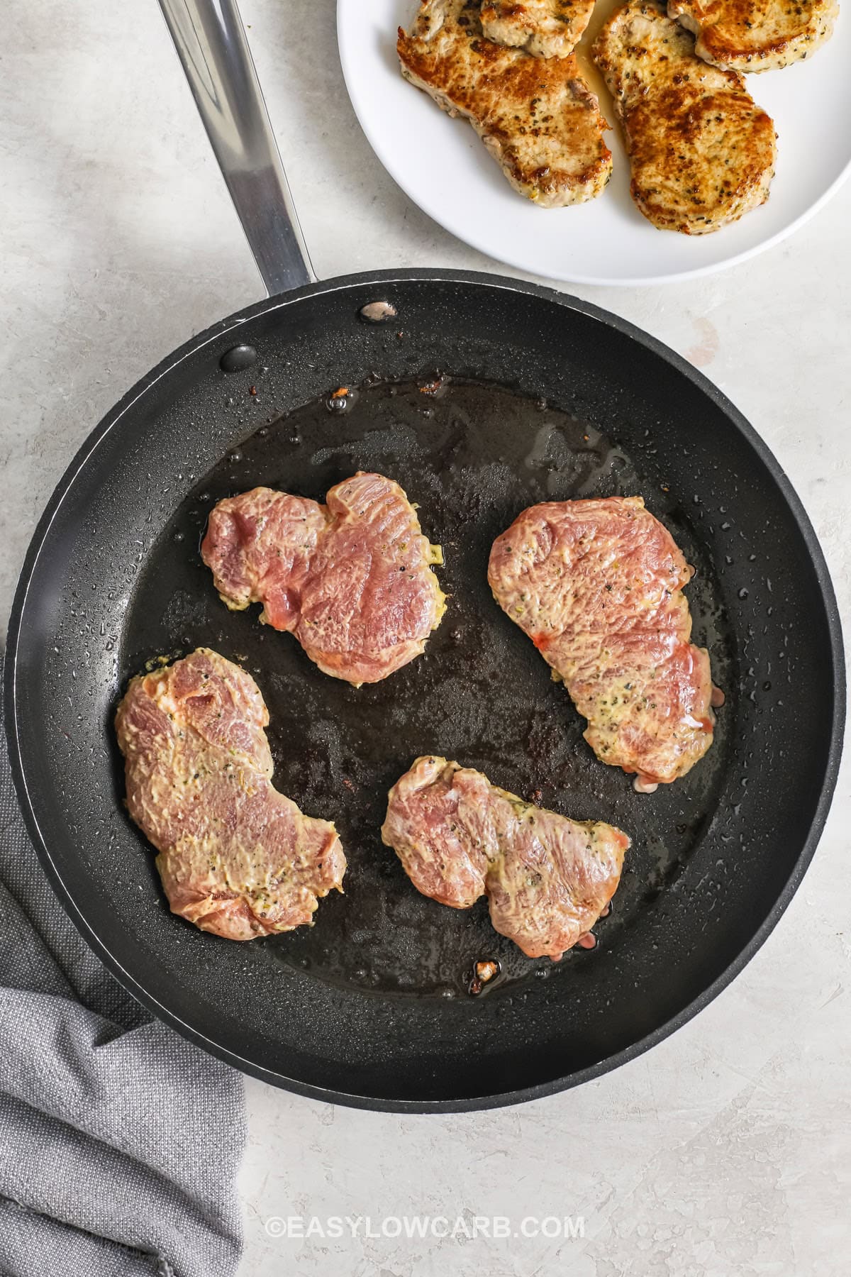 frying pork in a pan to make Creamy Dijon Pork Tenderloin Medallions