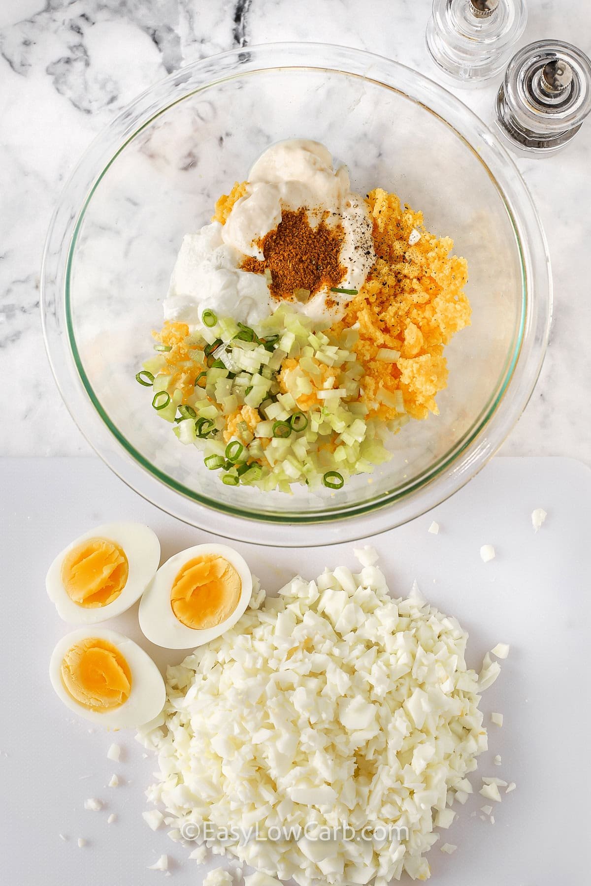 adding seasonings to cooked egg yolks to make Curried Egg Salad