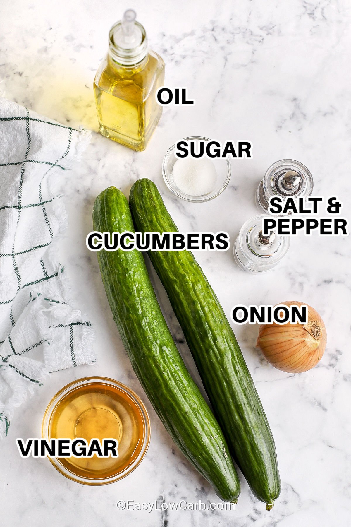 ingredients to make cucumber & onion salad with labels, including oil, sugar, salt & pepper, cucumbers, onion, vinegar