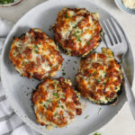 top view of Lasagna Stuffed Mushrooms on a plate