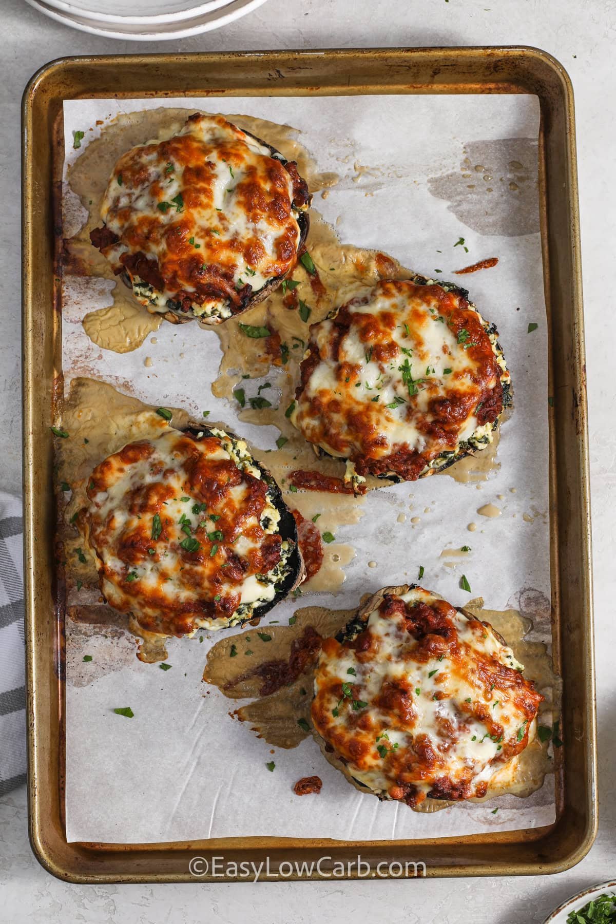 cheesy Lasagna Stuffed Mushrooms baked on a sheet pan