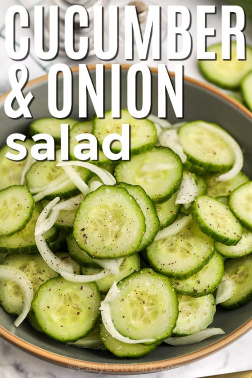 Cucumber & onion salad in a bowl with writing