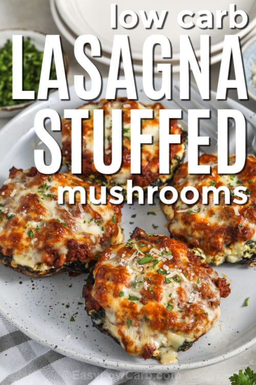 low carb Lasagna Stuffed Mushrooms on a plate with writing