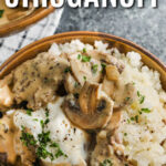 close up of Keto Beef Stroganoff in a bowl with mashed potatoes and writing