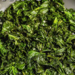 Sautéed Kale in the pan with a title