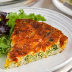 slice of Broccoli Cheese Quiche on a plate
