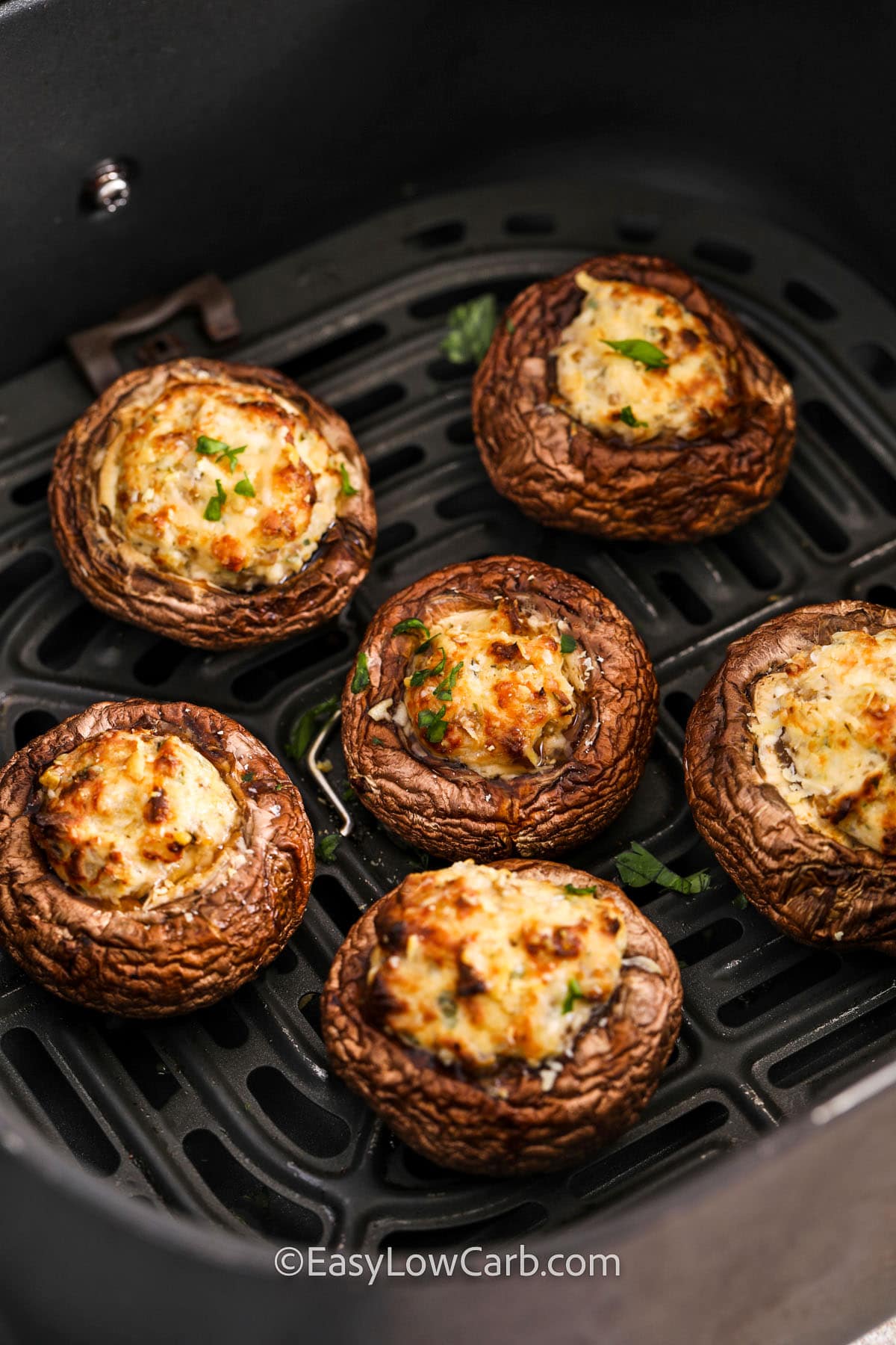 close up of Air Fryer Stuffed Mushrooms in the air fryer
