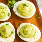 Avocado Deviled Eggs on a cutting board