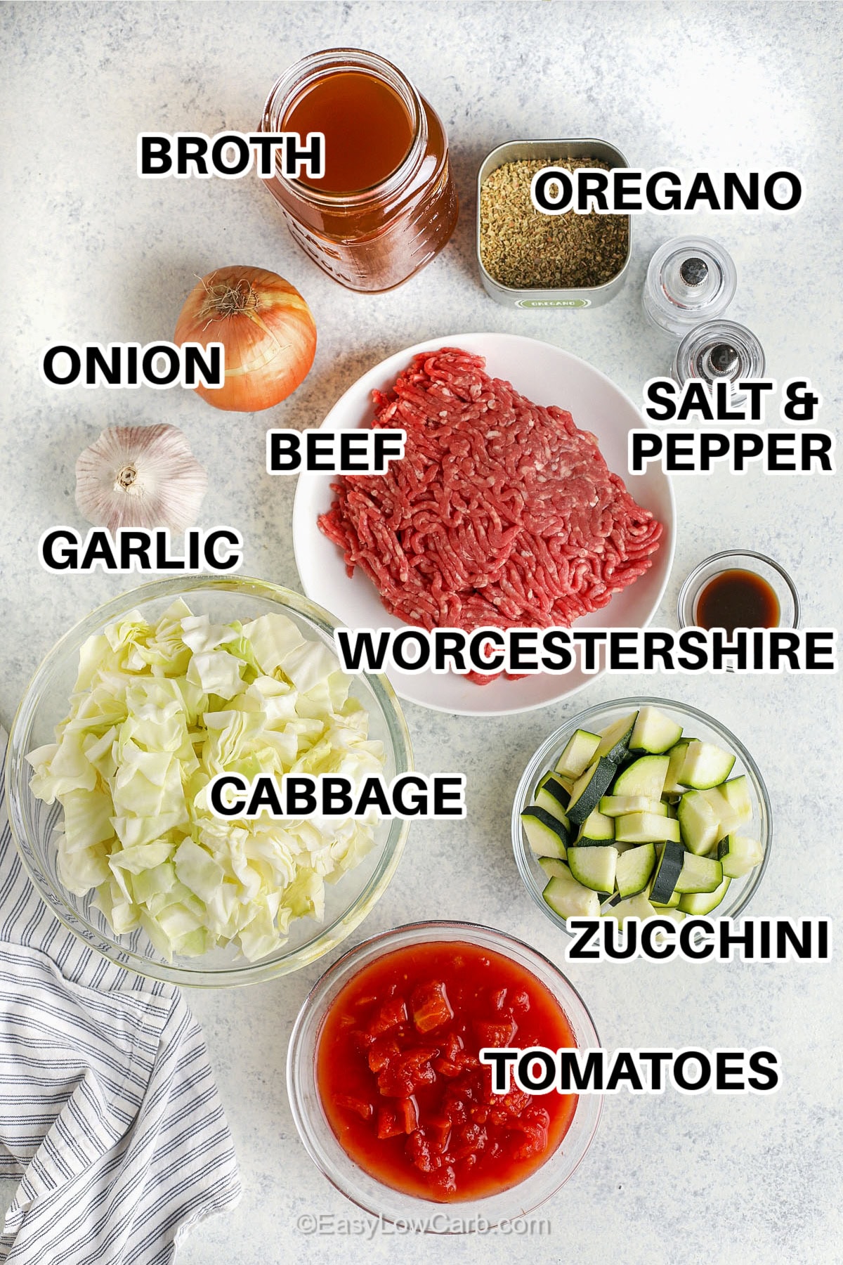 broth , oregano , onion , garlic , beef , cabbage , Worcestershire , zucchini , tomatoes , salt and pepper with labels to make Ground Beef Vegetable Soup