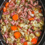thick and hearty Ham Bone Soup Recipe in the pot with writing