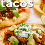 close up of Shredded Pork Tacos with writing