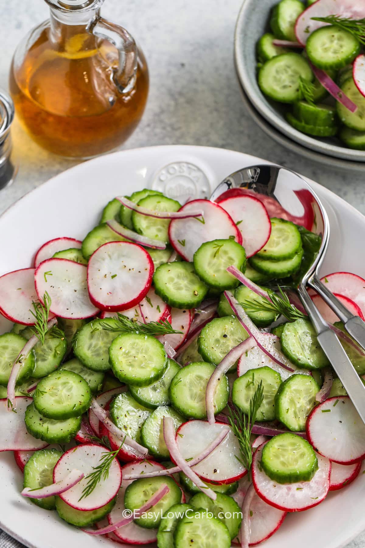cropped cucumber radish salad in a bowl.