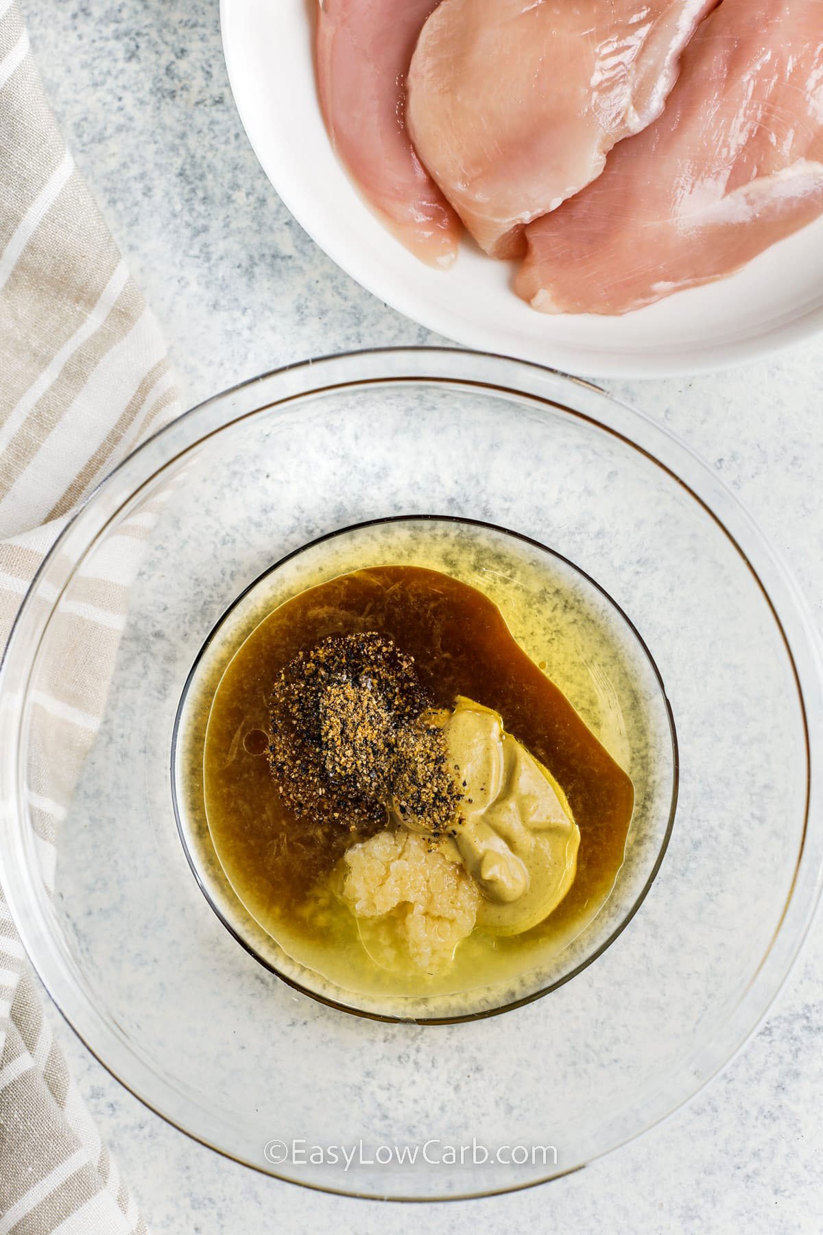 adding ingredients to bowl to make dressing for Grilled Chicken Breasts