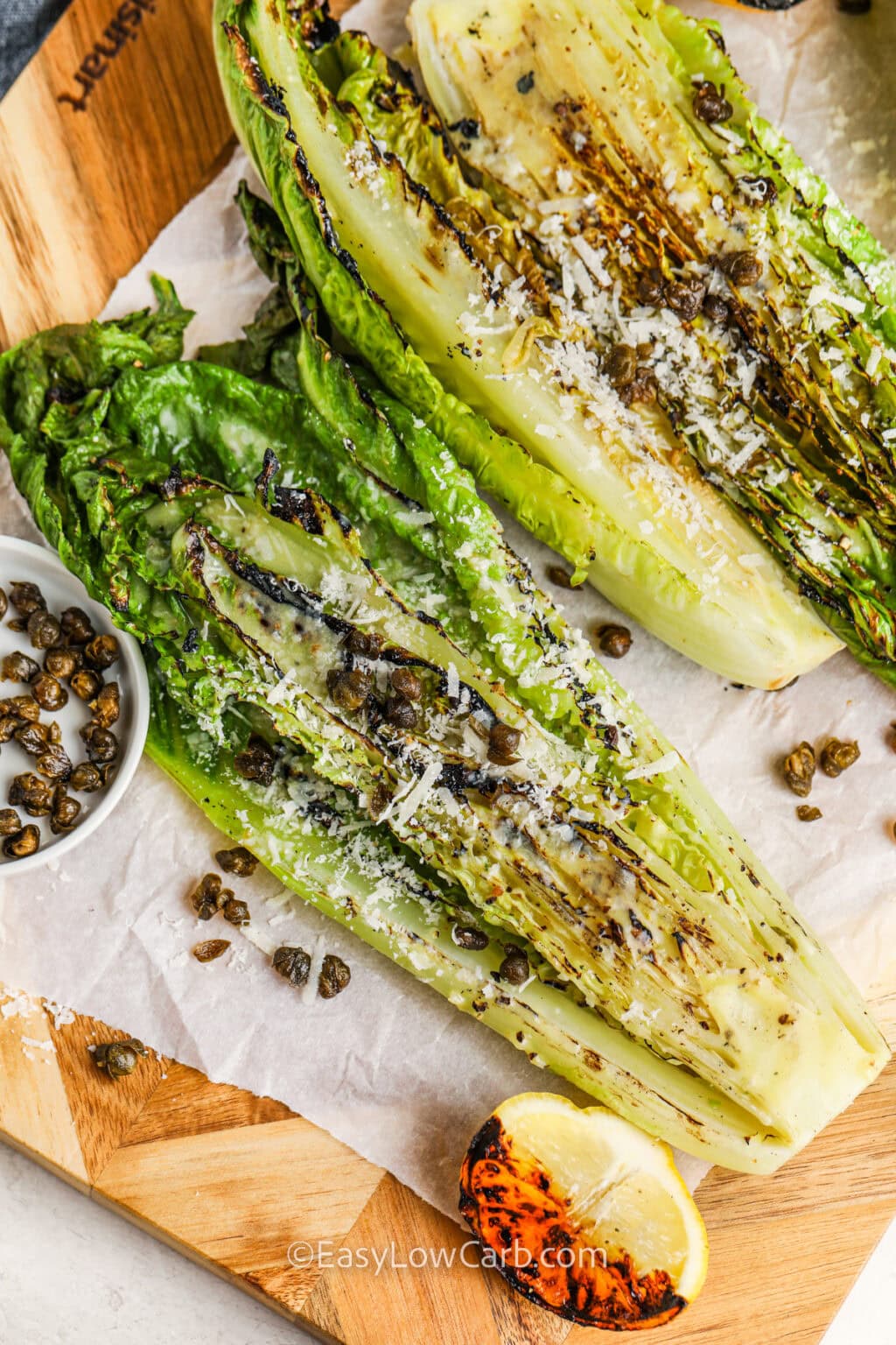 Grilled romaine turns your everyday salad into a smoky, satisfying dish that’s low carb and full of flavor. After a quick sear on the grill, the romaine is dressed in a bold mix of olive oil, red wine vinegar, lemon juice, garlic, and Parmesan. Crispy fried capers add a crunchy, salty finish that’s craveable. This easy salad is perfect for warm days when you want something fresh, fast, and delicious! #easylowcarb Grilled Romaine Salad with capers