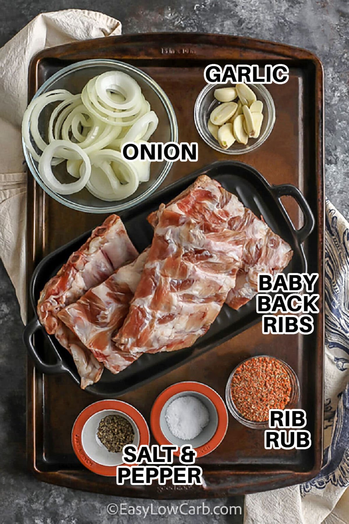onion , garlic , rib rub , salt and pepper , baby back ribs with labels to make Oven Baked Ribs Recipe