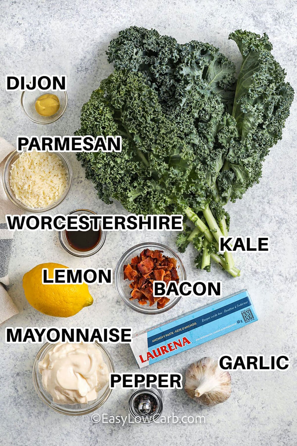dijon , parmesan , worcestershire , lemon , mayonnaise , bacon , pepper , garlic , kale , anchovy paste with labels to make Kale Caesar Salad
